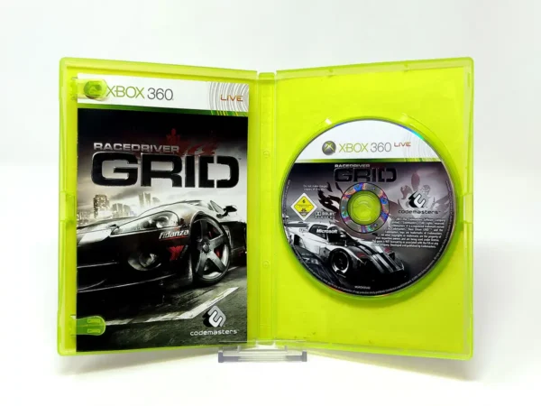 Interior del juego Grid (ESP) para XBOX 360 con disco y manual