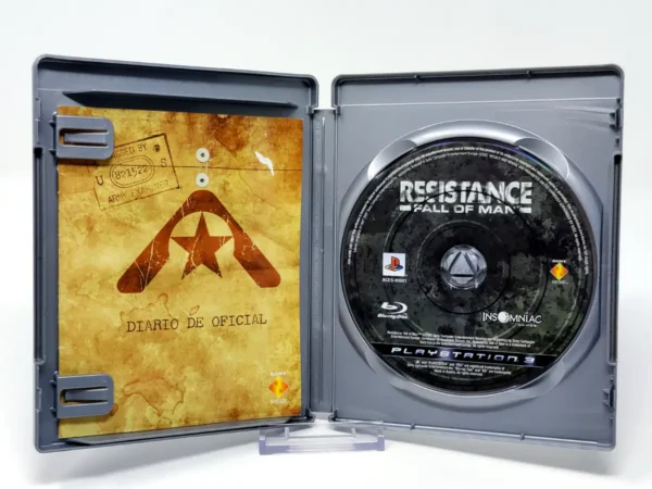 Interior del juego Resistance: Fall of Man (ESP) (Platinum) para PlayStation 3 con disco y manual