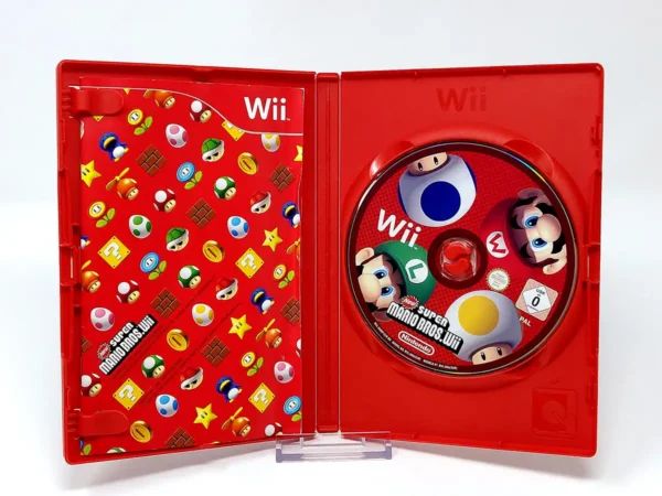 Interior del juego New Super Mario Bros. Wii (ESP) para Nintendo Wii con disco y manual