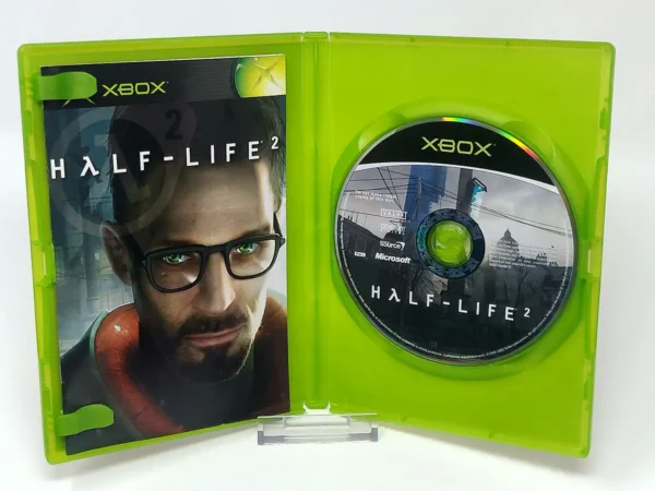 Interior del juego Half-Life 2 (ESP) para XBOX con disco y manual