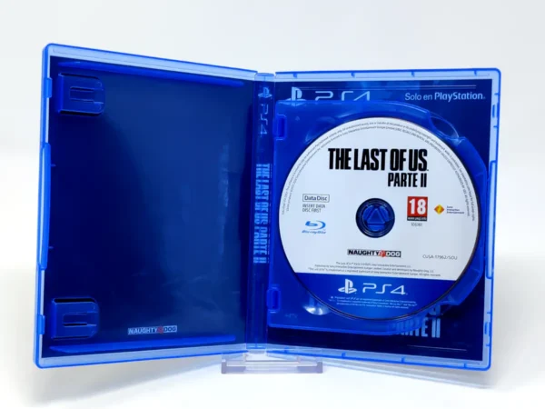 Interior del juego The Last of Us: Part II (ESP) para PlayStation 4 con disco y manual