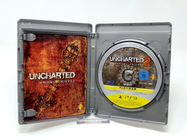 Interior del juego Uncharted 2: Among Thieves (FRA) (Platinum) para PlayStation 3 con disco y manual