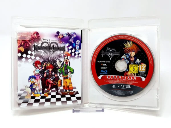 Interior del juego Kingdom Hearts: HD 1.5 ReMIX (ESP) (Essentials) para PlayStation 3 con disco y manual