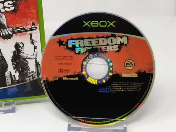 Interior del juego Freedom Fighters (UK) para XBOX con disco y manual