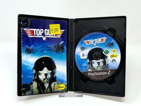 Interior del juego Top Gun (ITA) para PlayStation 2 con disco y manual