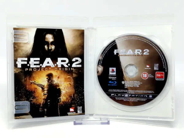 Interior del juego F.E.A.R. 2: Project Origin (ESP) para PlayStation 3 con disco y manual
