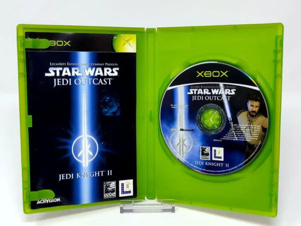 Interior del juego Star Wars: Jedi Knight II: Jedi Outcast (ESP) para XBOX con disco y manual