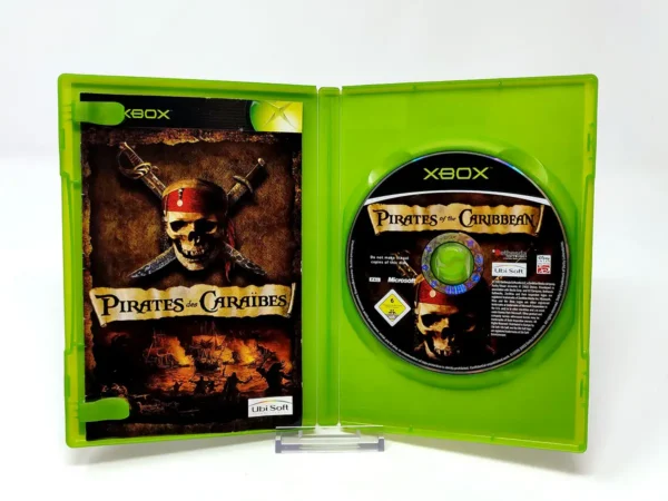 Interior del juego Pirates des Caraïbes (FRA) para XBOX con disco y manual