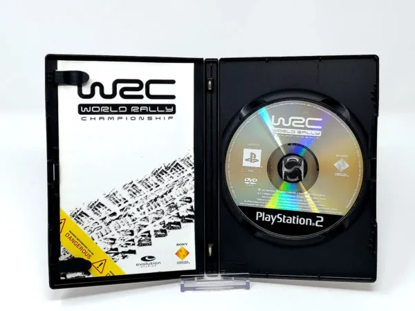 Interior del juego WRC: World Rally Championship (FRA) para PlayStation 2 con disco y manual