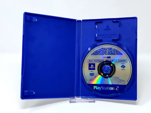 Interior del juego Ace Combat: Jefe de Escuadrón (ESP) (Promo) para PlayStation 2 con disco y manual