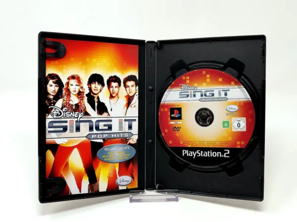 Interior del juego Disney Sing It: Pop Hits (FRA) para PlayStation 2 con disco y manual