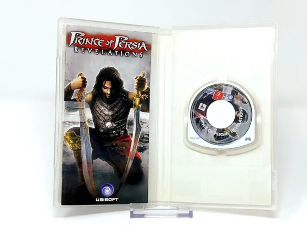 Interior del juego Prince of Persia: Revelations (ESP) para PSP con disco y manual