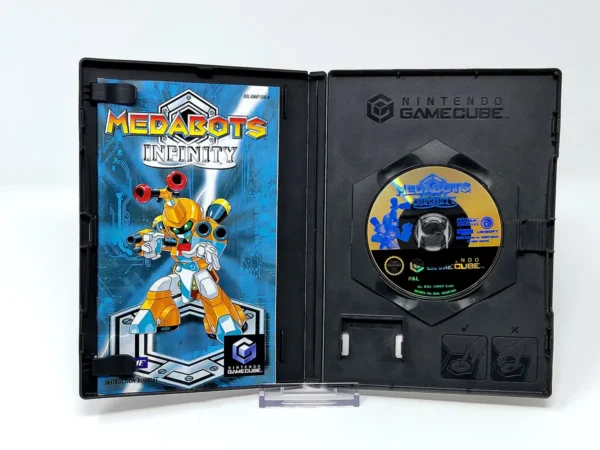 Interior del juego Medabots Infinity (ESP) para Nintendo GameCube con disco y manual