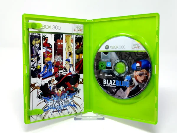 Interior del juego BlazBlue: Calamity Trigger (ESP) para XBOX 360 con disco y manual