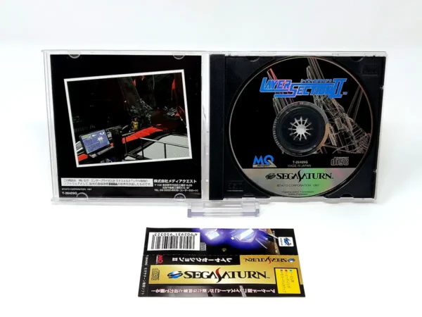 Interior del juego Layer Section II (JAP) para Sega Saturn con disco y manual