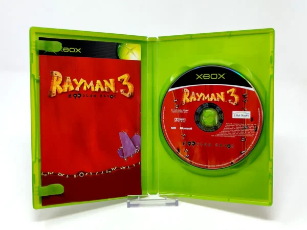 Interior del juego Rayman 3: Hoodlum Havoc (UK) (Classics) para XBOX con disco y manual