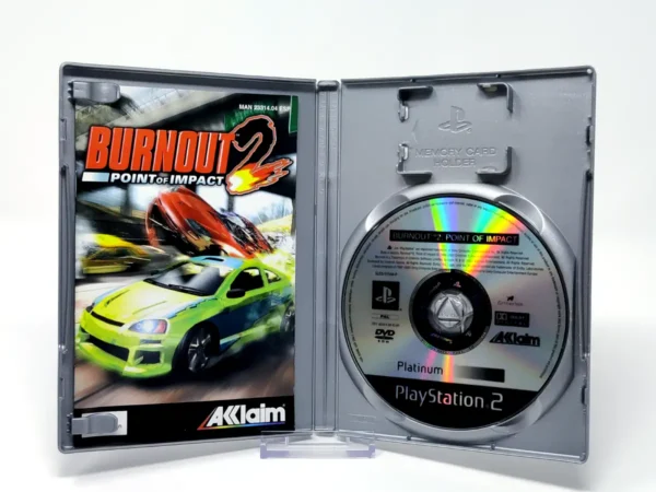 Interior del juego Burnout 2: Point of Impact (ESP) (Platinum) para PlayStation 2 con disco y manual