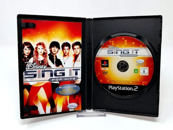 Interior del juego Disney Sing It: Pop Hits (ESP) para PlayStation 2 con disco y manual