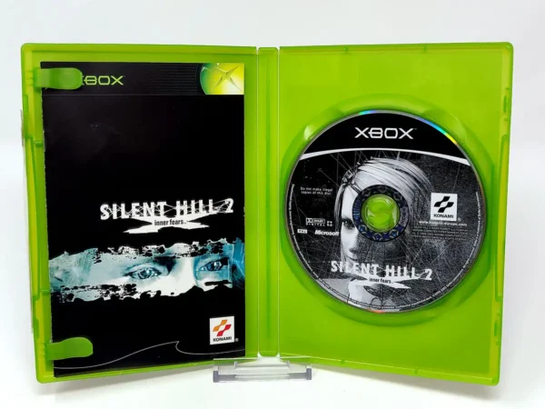 Interior del juego Silent Hill 2: Inner Fears (ESP) para XBOX con disco y manual
