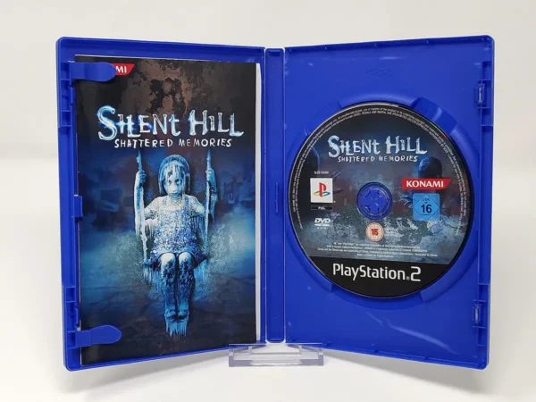 Interior del juego Silent Hill: Shattered Memories (ESP) para PlayStation 2 con disco y manual