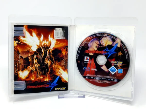 Interior del juego Devil May Cry 4 (ESP) para PlayStation 3 con disco y manual