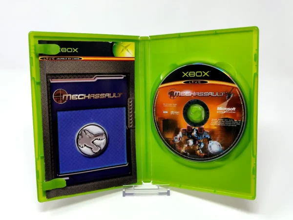 Interior del juego MechAssault (FRA) para XBOX con disco y manual