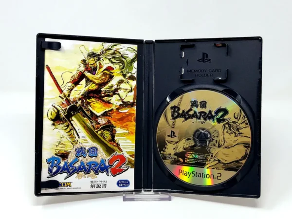 Interior del juego Sengoku Basara 2 (JAP) para PlayStation 2 con disco y manual