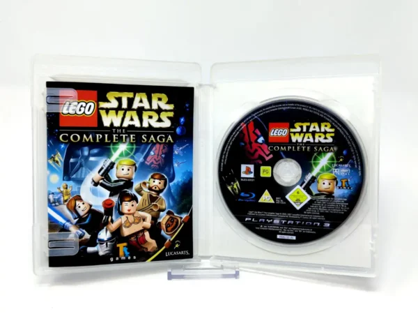 Interior del juego LEGO Star Wars: The Complete Saga (ESP) para PlayStation 3 con disco y manual