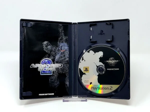 Interior del juego Armored Core 2 (JAP) para PlayStation 2 con disco y manual