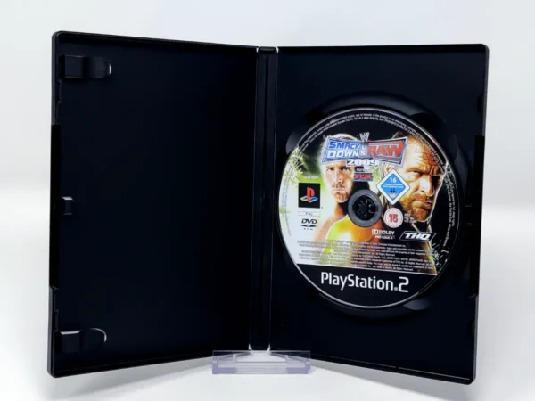 Interior del juego WWE SmackDown vs. Raw 2009 (FRA) (Rebajado) para PlayStation 2 con disco y manual