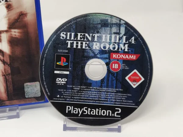 Interior del juego Silent Hill 4: The Room (ESP) para PlayStation 2 con disco y manual