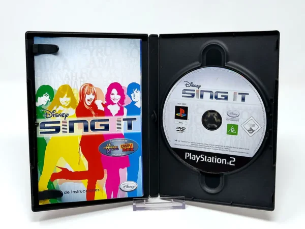 Interior del juego Disney Sing It (ESP) para PlayStation 2 con disco y manual
