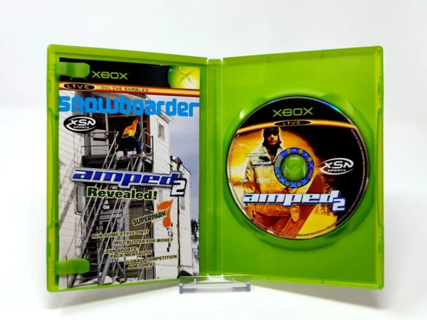 Interior del juego Amped 2 (UK) para XBOX con disco y manual