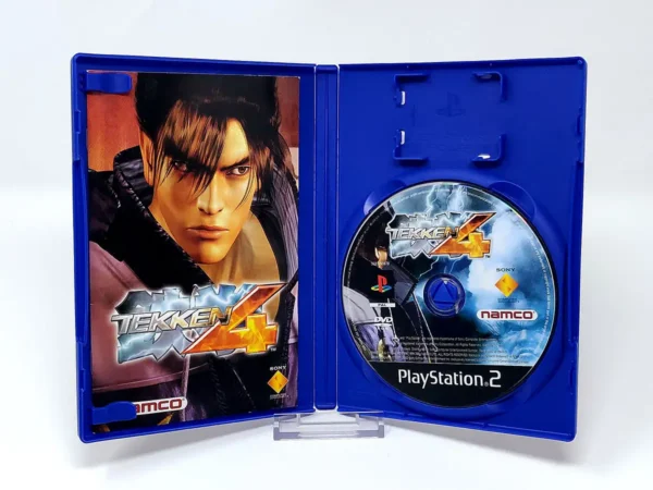 Interior del juego Tekken 4 (FRA) para PlayStation 2 con disco y manual