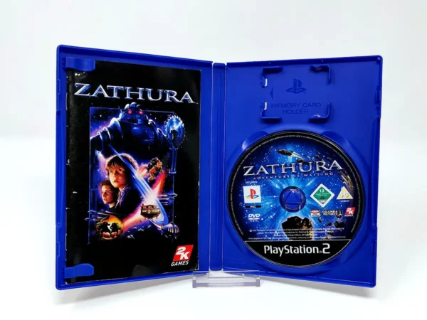 Interior del juego Zathura (FRA) para PlayStation 2 con disco y manual