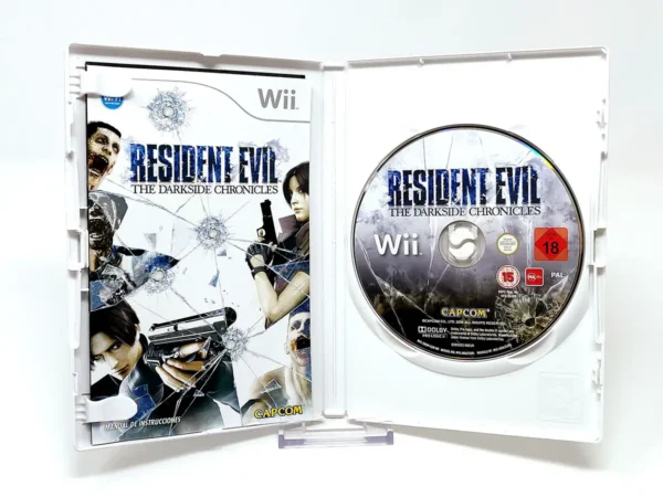 Interior del juego Resident Evil: The Darkside Chronicles (ESP) para Nintendo Wii con disco y manual