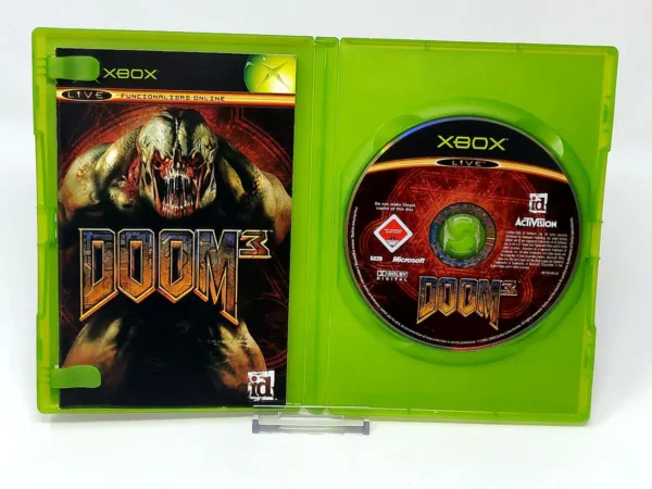 Interior del juego DOOM 3 (ESP) para XBOX con disco y manual