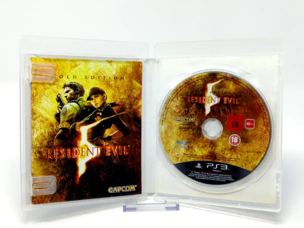 Interior del juego Resident Evil 5: Gold Edition (ESP) para PlayStation 3 con disco y manual