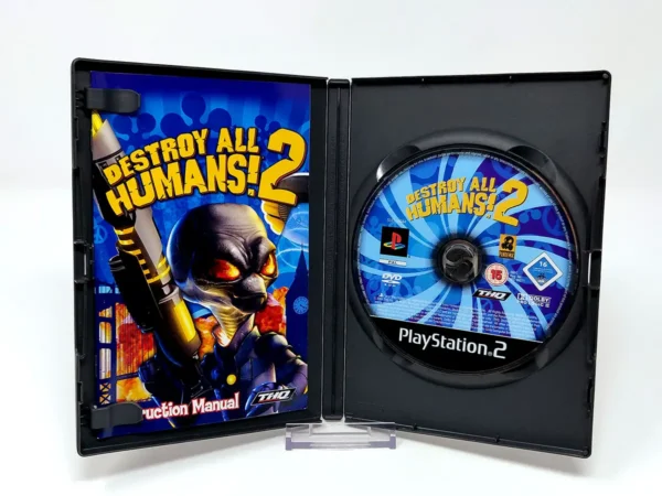 Interior del juego Destroy All Humans! 2 (UK) para PlayStation 2 con disco y manual
