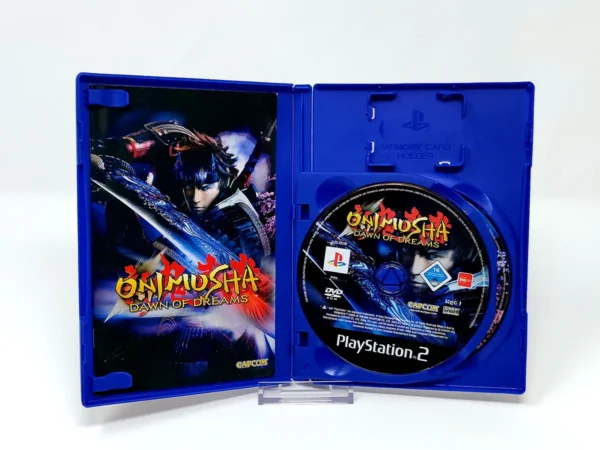 Interior del juego Onimusha: Dawn of Dreams (UK) para PlayStation 2 con disco y manual