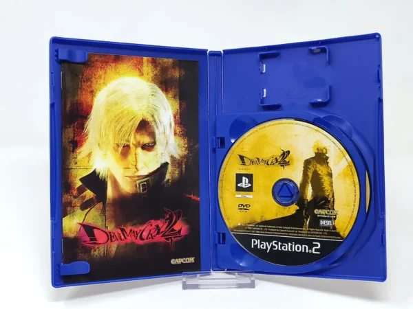 Interior del juego Devil May Cry 2 (ESP) para PlayStation 2 con disco y manual