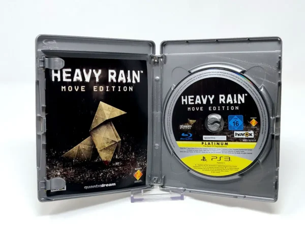 Interior del juego Heavy Rain: Move Edition (ESP) (Platinum) para PlayStation 3 con disco y manual