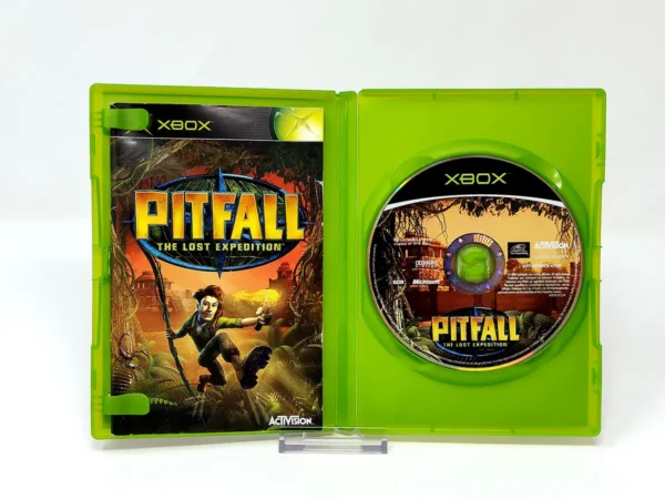 Interior del juego Pitfall: The Lost Expedition (ESP) para XBOX con disco y manual