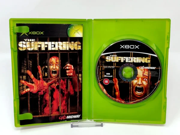 Interior del juego The Suffering (ESP) para XBOX con disco y manual