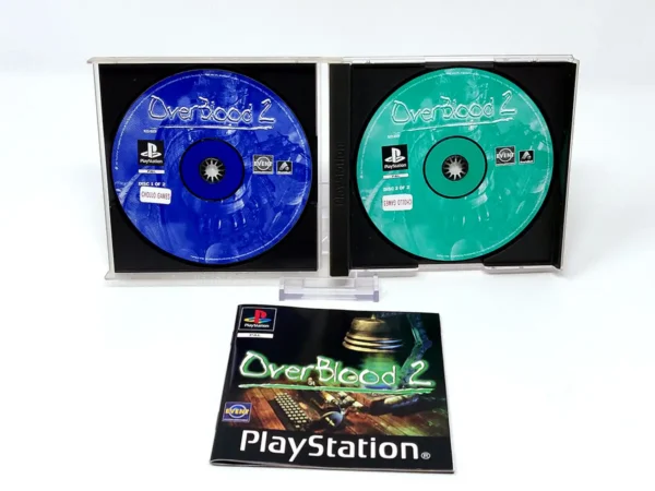 Interior del juego OverBlood 2 (UK) para PlayStation 1 con disco y manual