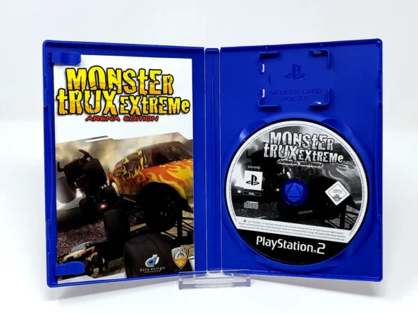 Interior del juego Monster Trux Extreme: Arena Edition (FRA) para PlayStation 2 con disco y manual