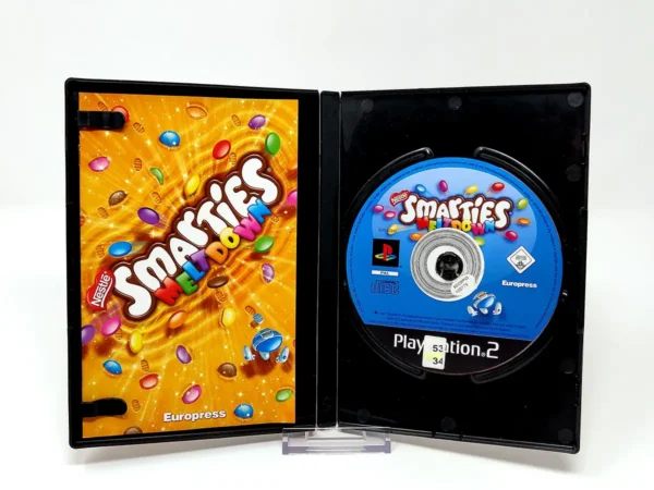 Interior del juego Smarties: Meltdown (UK) para PlayStation 2 con disco y manual