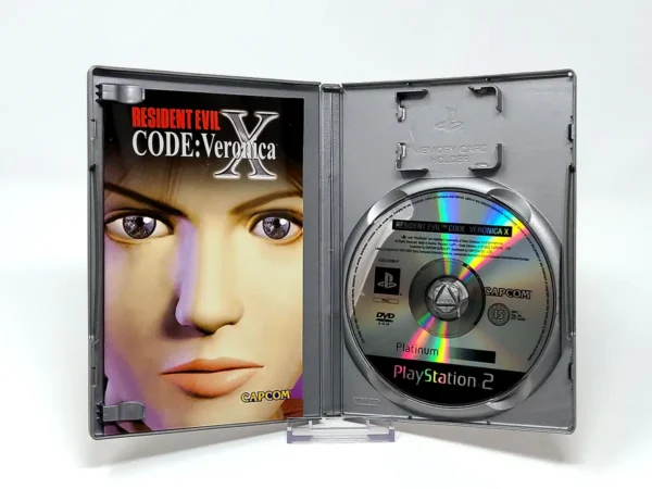 Interior del juego Resident Evil: Code - Veronica X (ESP) (Platinum) (v1) para PlayStation 2 con disco y manual
