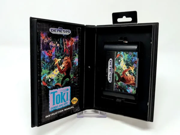 Interior del juego Toki: Going Ape Spit (USA) para Sega Mega Drive con disco y manual