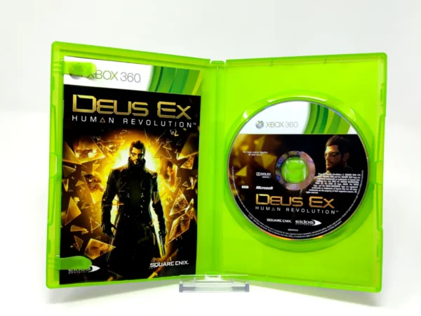 Interior del juego Deus Ex: Human Revolution (ESP) para XBOX 360 con disco y manual